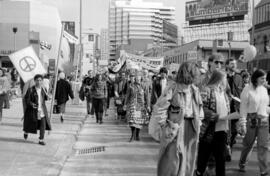 Protestors in the street, holding peace signs. Toronto, 1988.