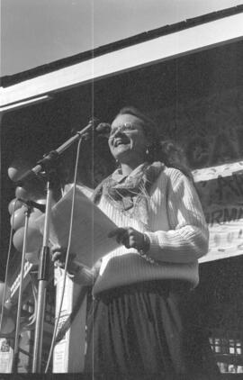 A woman speaking in front of a microphone. Toronto, 1988.