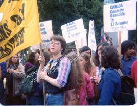 Demonstrators carrying "Canada condemns genocide in El Salvador" signs with Cindy Wright and Amy ...