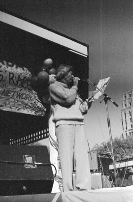 Woman speaking from a gazebo. Toronto, 1988.