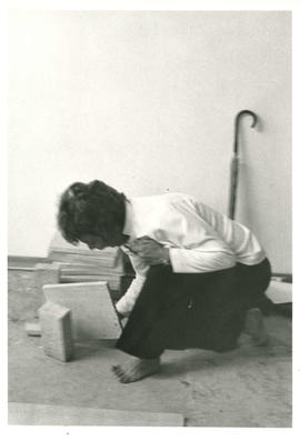 Self defence teacher breaking wooden board with board falling in mid-air during self-defence clas...