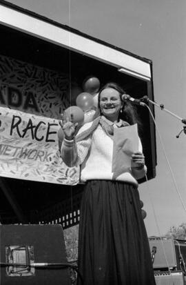 Woman waving in front of a microphone. Toronto, 1988.