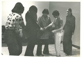 Women during self-defence class standing and looking at the Amazon Self-Defence and Toronto Women...