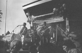Band playing on a gazebo in front of a crowd. Toronto, 1988.