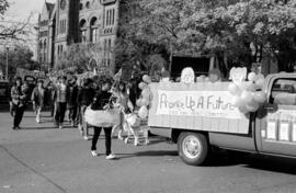 Protesters following an East York Peace Committee truck, in front of the Ontario Legislative Buil...
