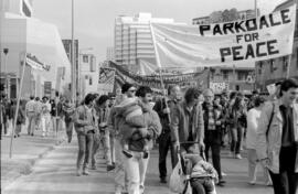 Protesters holdings signs in the street. Toronto, 1988.