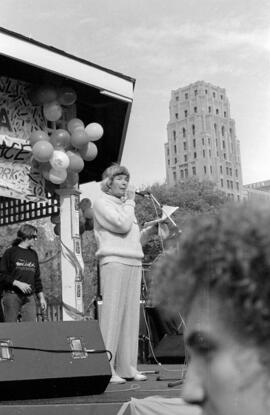 Woman speaking from a gazebo. Toronto, 1988.