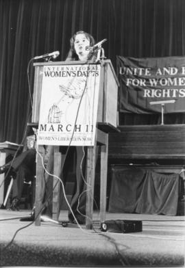 Heather MacNeil from SORWUC front view speaking at podium during the IWD 78, Convocation Hall