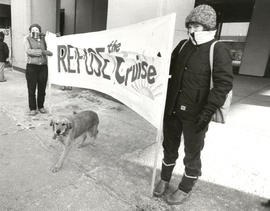 Two individuals [Dr. Barb Giles and Deb] holding Refuse the cruise banner