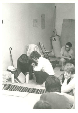 Woman teaching how to break wooden boards with umbrella leaning against wall at the Amazon Self-Defence and Toronto Women's Self Defence Centre, Toronto