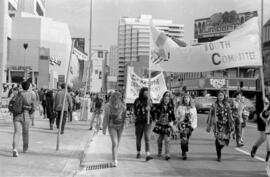 Women protesting and holding signs in the street. Toronto, 1988.