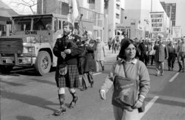 Bagpiper and veterans protest in the street. Toronto, 1988.