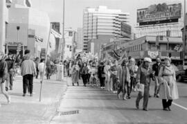 Protestors in the street, holding peace signs. Toronto, 1988.