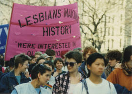 Participants carrying a "Lesbian making  history. We are interested in older women" banner at the...
