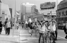 Protestors in the street, holding "No To Star Wars" signs. Toronto, 1988