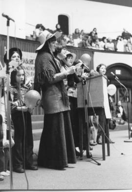 Ottie Lockey leading singing during the IWD 1978 side view, Rally Convocation Hall